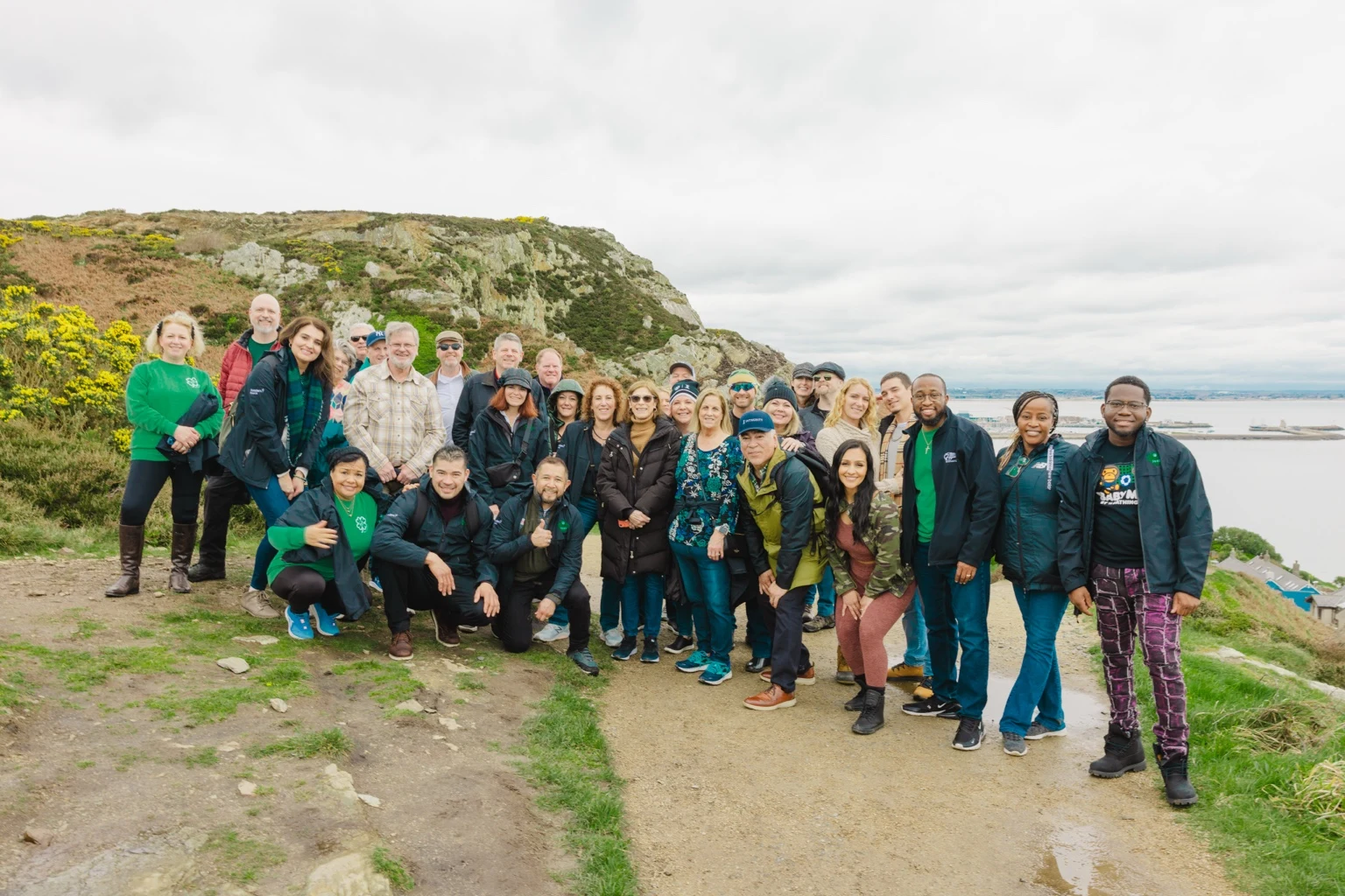 Money Alliance Club team gathered together at a coastal overlook