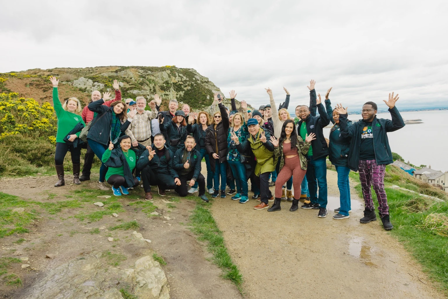 Team members celebrating on a coastal trip