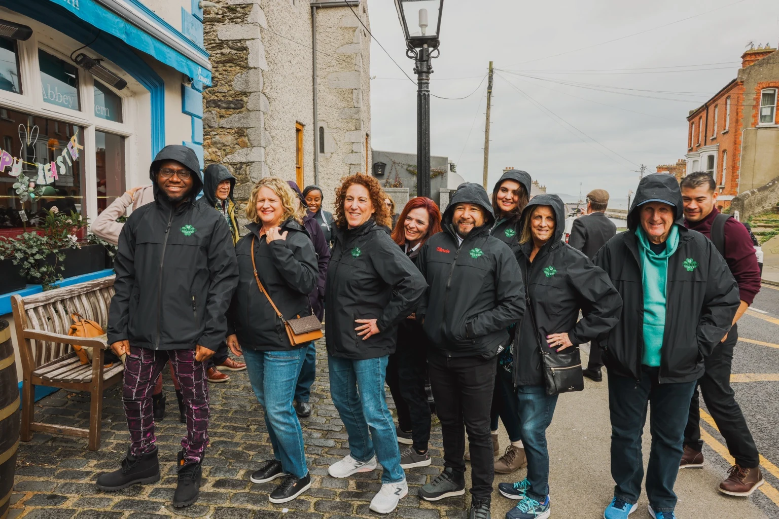 Team members standing together on a town street
